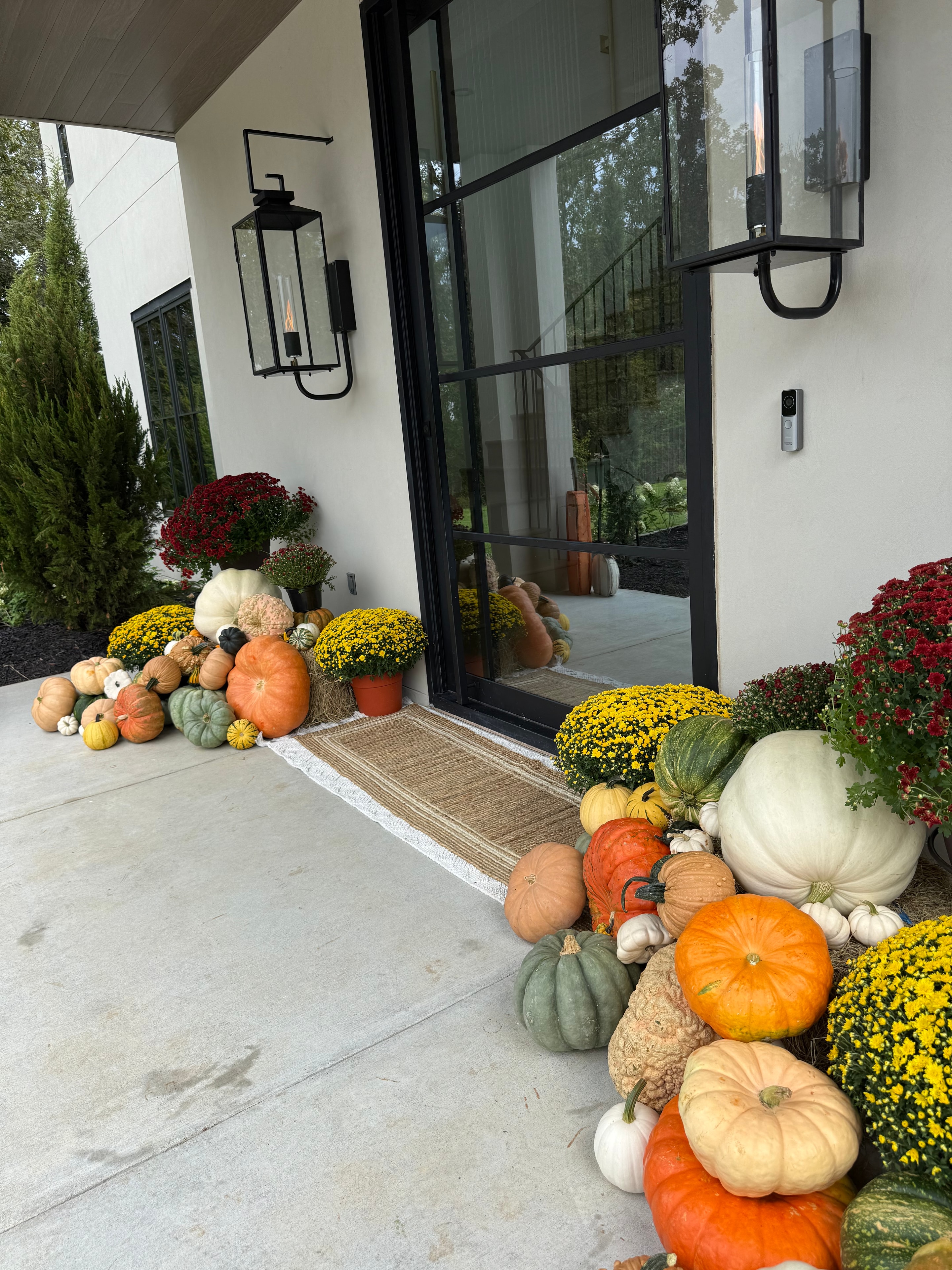 Seasonal porch styling with hay bales and pumpkins